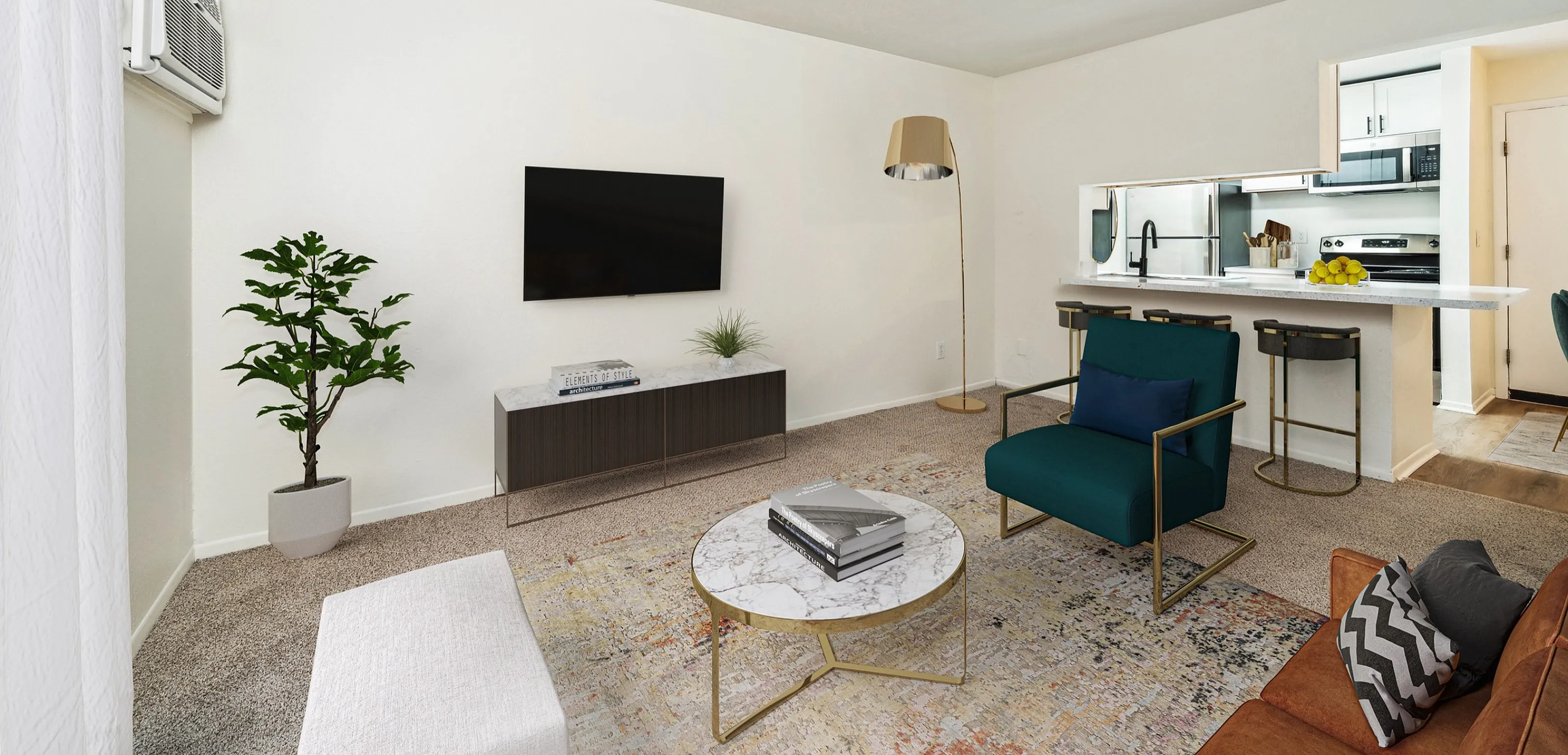 Elegant living room with modern decor, featuring a cozy seating area, stylish furniture, and a sleek open kitchen with a breakfast bar.