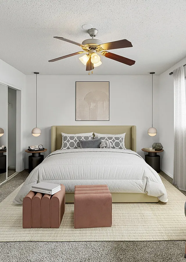 Elegant bedroom showcasing a plush bed, mirrored wardrobe, and chic decor with natural light streaming in.