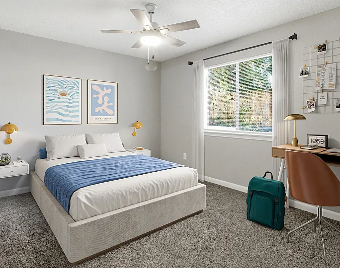 Bright and modern bedroom with sleek decor, featuring a comfortable bed, stylish artwork, and a cozy workspace by the window.