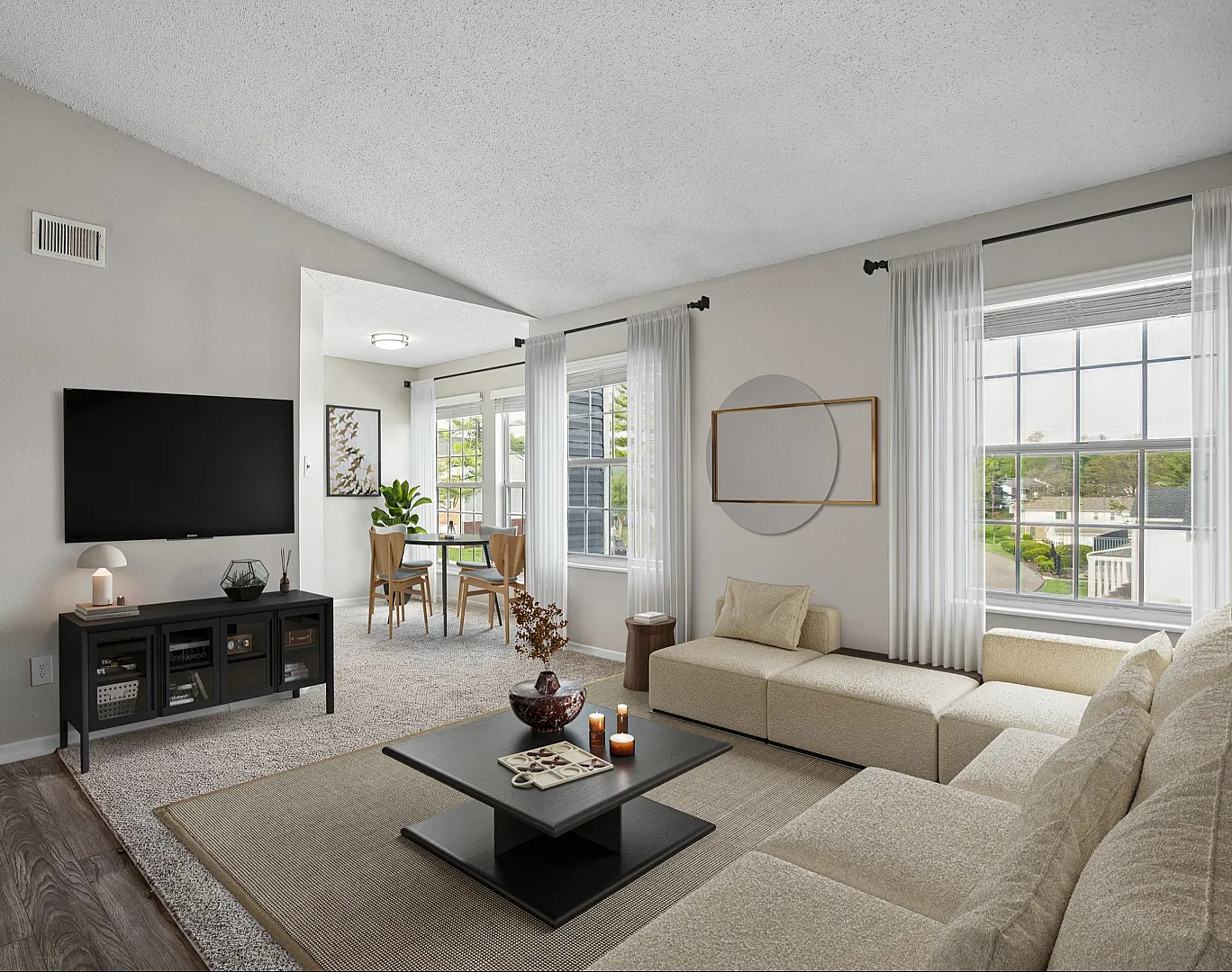 Inviting living room with modern decor, flat-screen TV, elegant dining area, and large windows for abundant natural light.