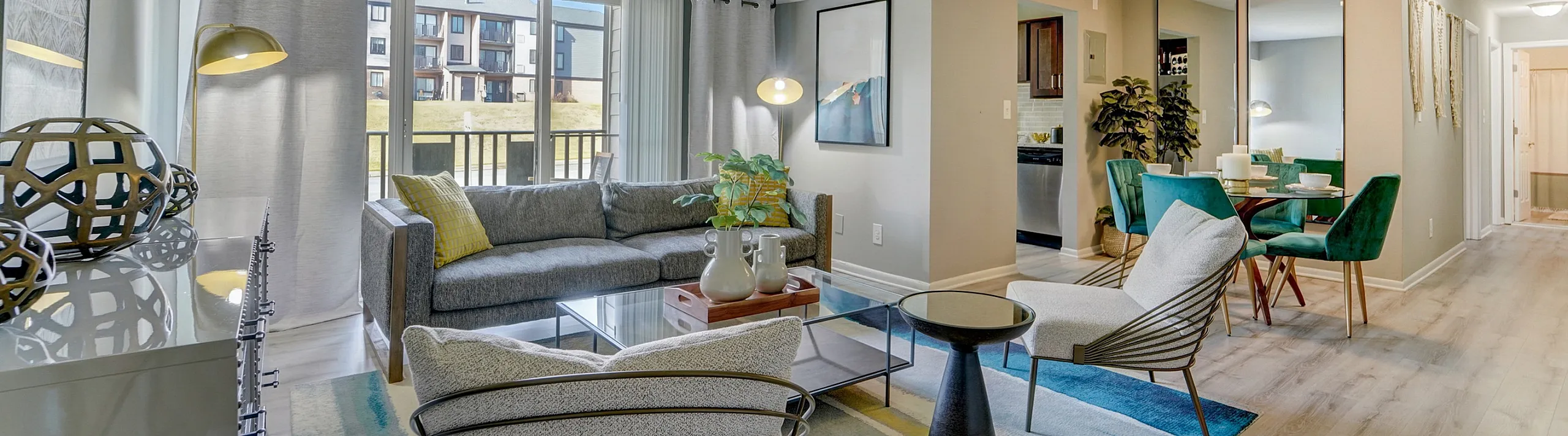 Bright and modern living room with elegant furniture, stylish decor, and a view of the outdoor patio, perfect for relaxation and entertaining.