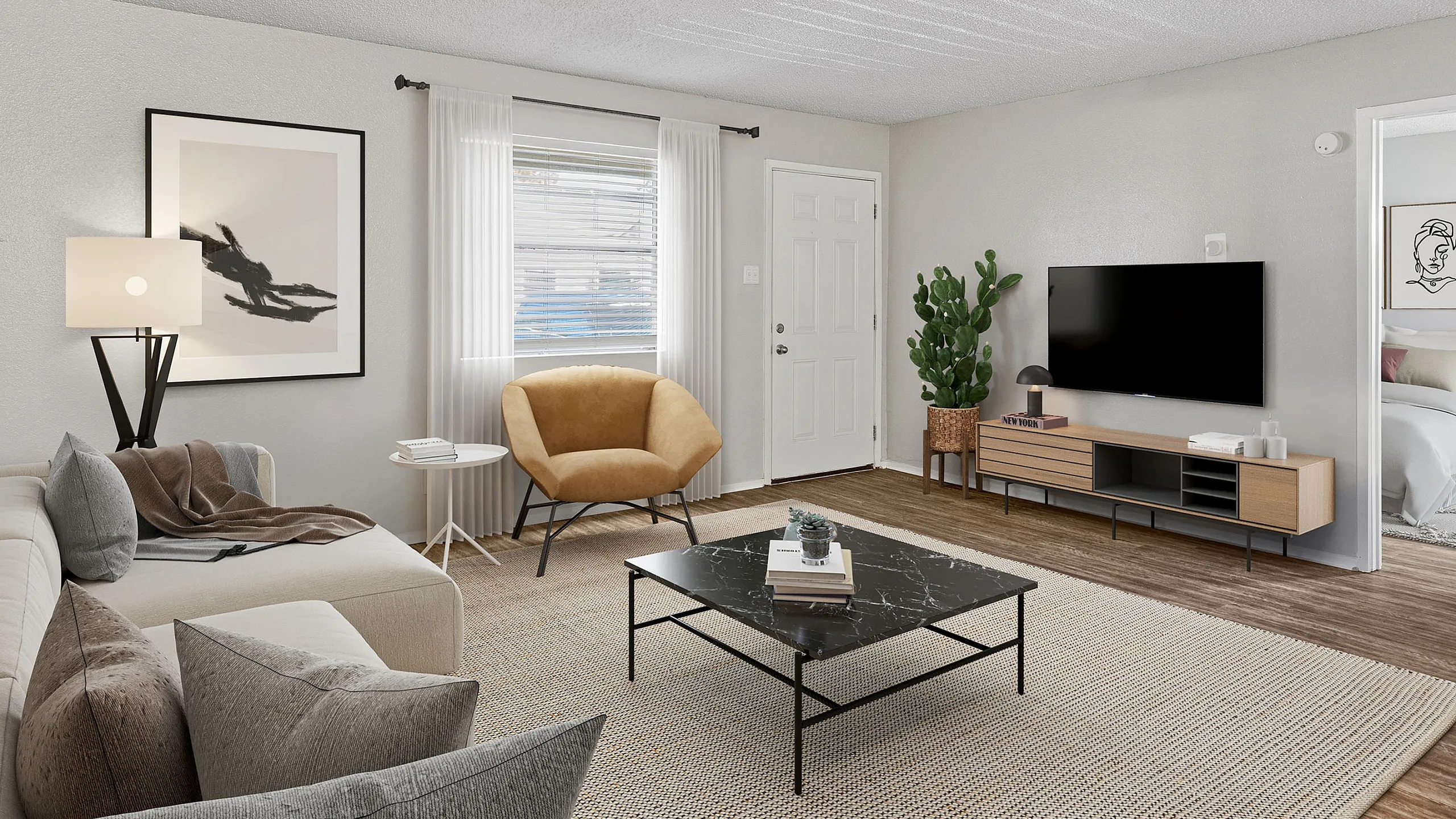 Chic living room with modern decor, cozy light-toned sofa, stylish coffee table, and wall-mounted TV. Natural light filters through large window, enhancing the neutral palette and giving a welcoming feel.