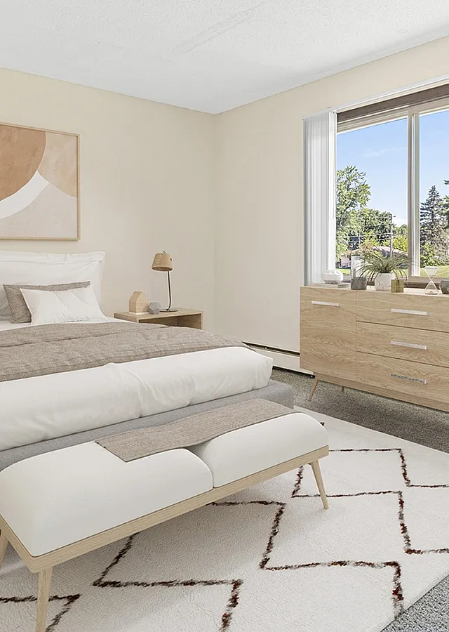 Bright and serene bedroom with stylish decor, large window, and cozy furnishings offering a peaceful retreat.