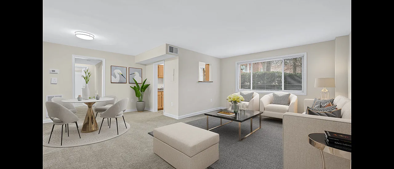 Inviting apartment living room with stylish seating, large window, and adjacent dining area for a cozy ambiance.