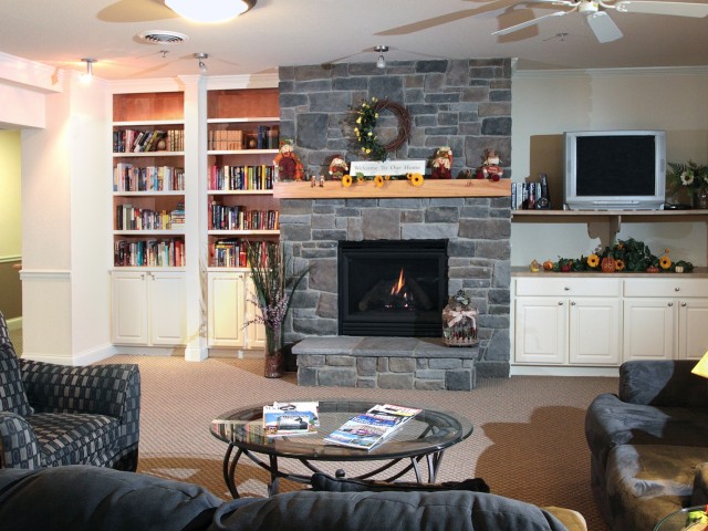 Image of Separate Family Room with Fireplace & Library for Smaller Family Gatherings for Liberty Square