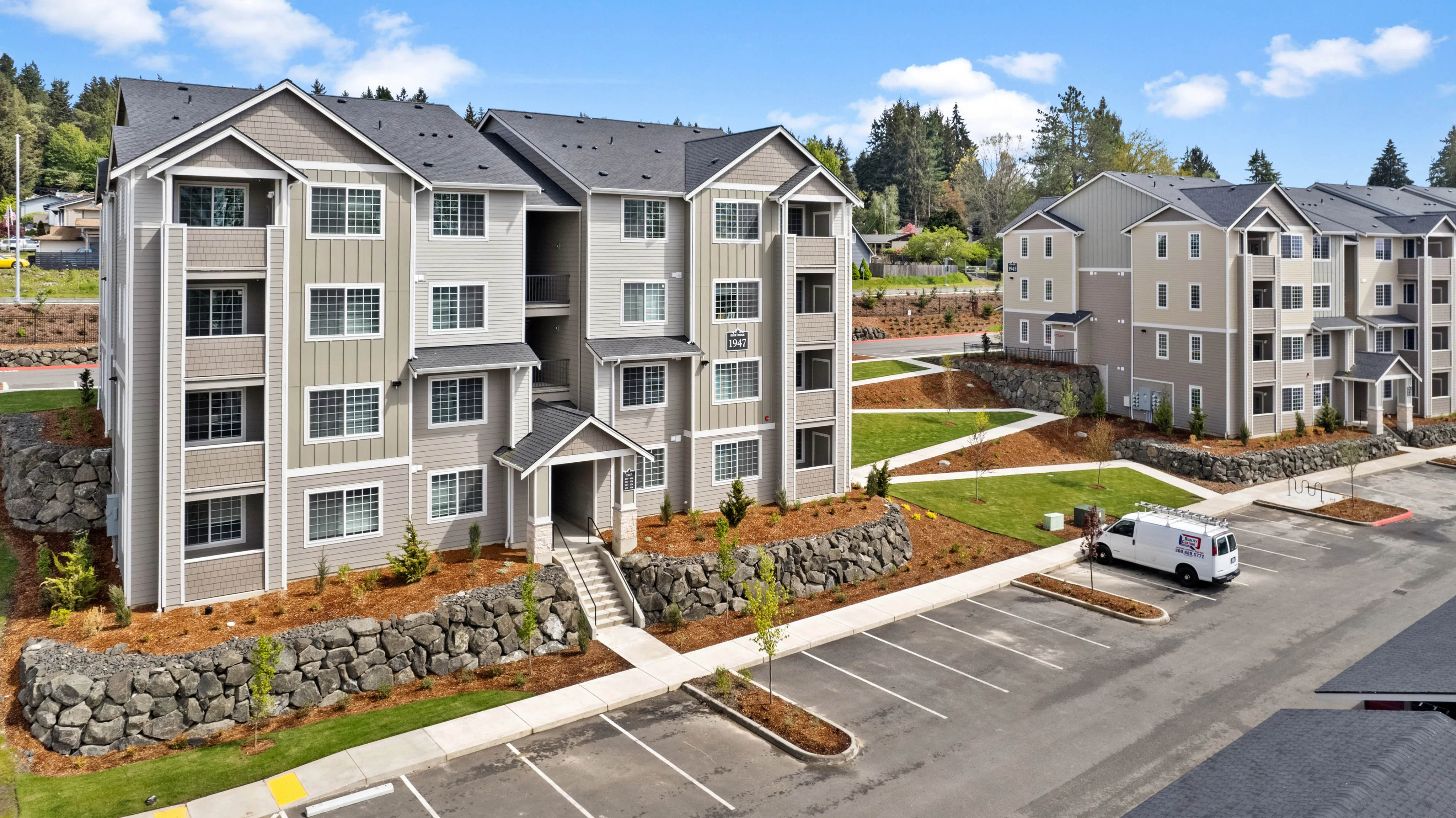 Apartment Building Exterior + Resident Walkway l Luxury Apartments and Townhomes for Rent in Bremerton, WA l Blue Ridge Apartments