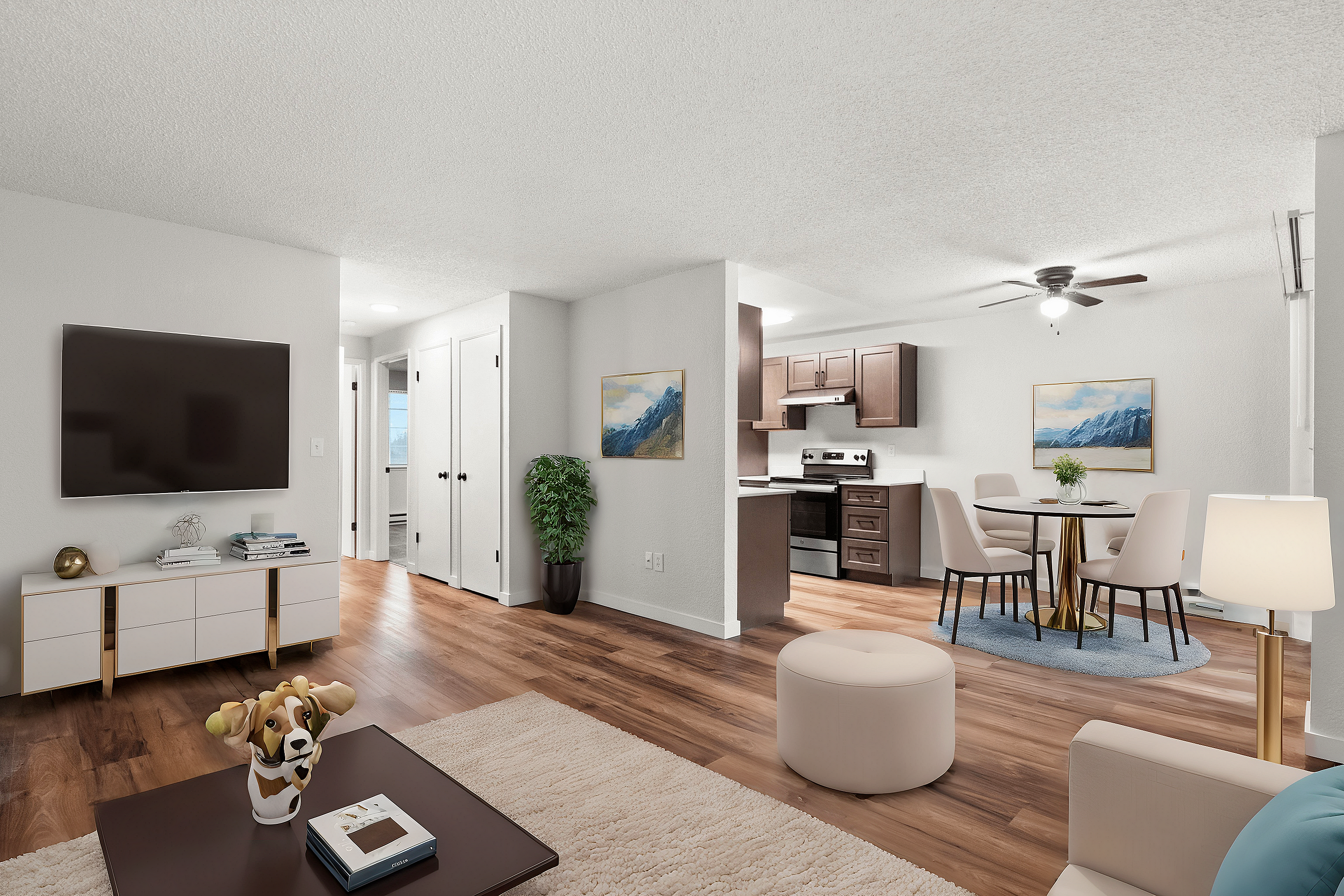 Modern open-concept living room with hardwood floors, cozy seating area, and elegant kitchen.