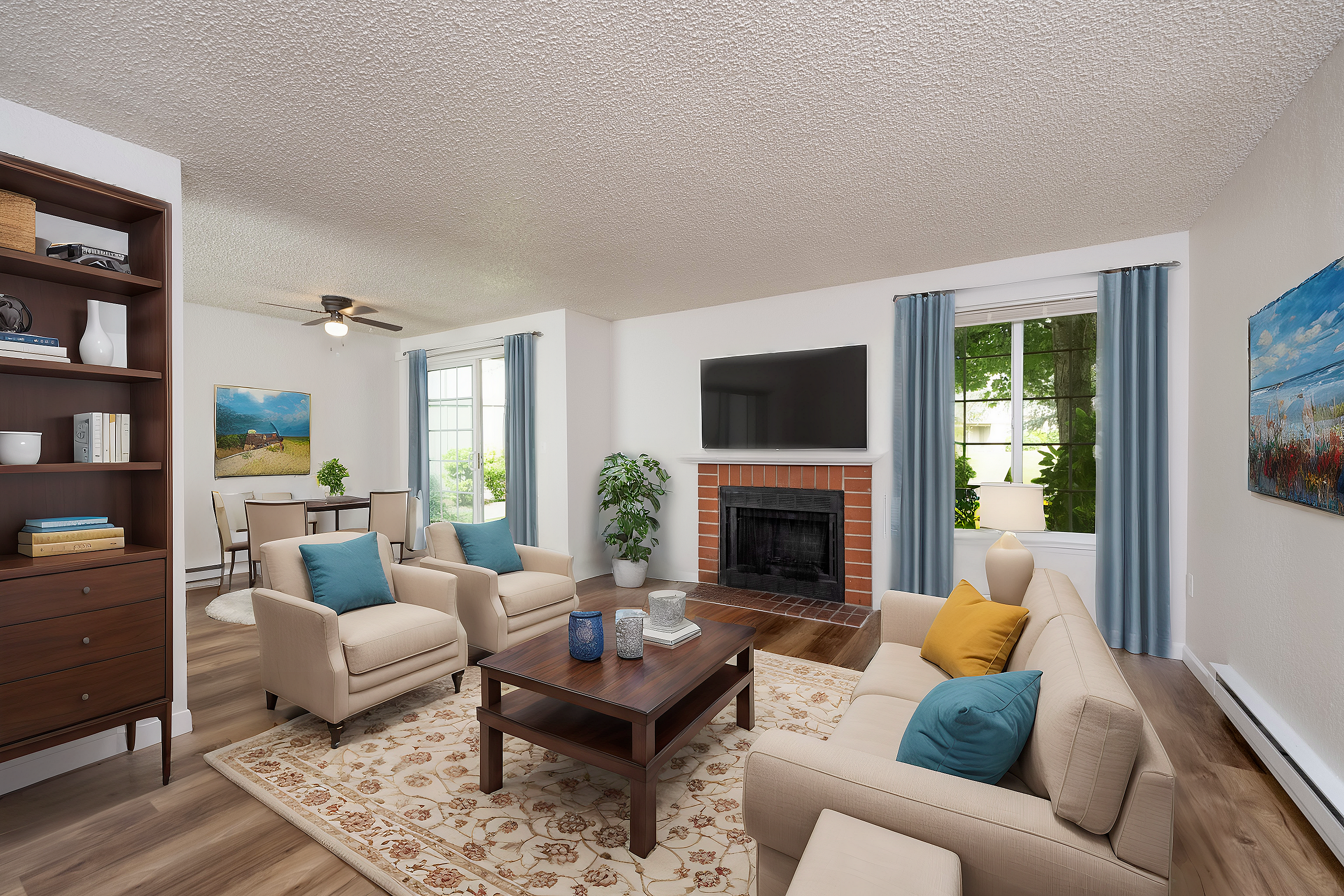 Inviting living room featuring a fireplace, comfortable seating, and large windows with natural light.