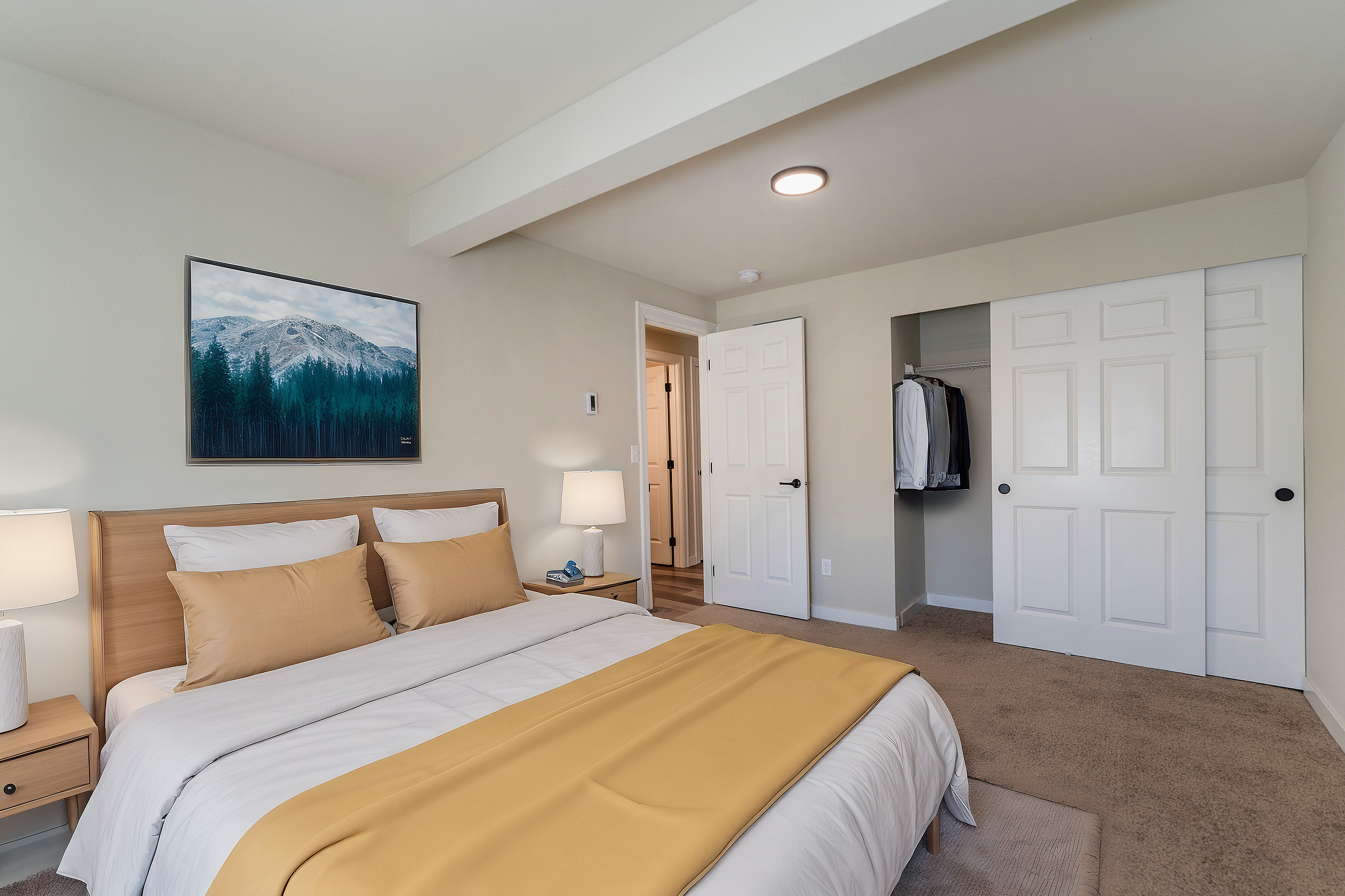 Bright and inviting bedroom with a stylish wooden bed, soft lighting, and elegant decor.