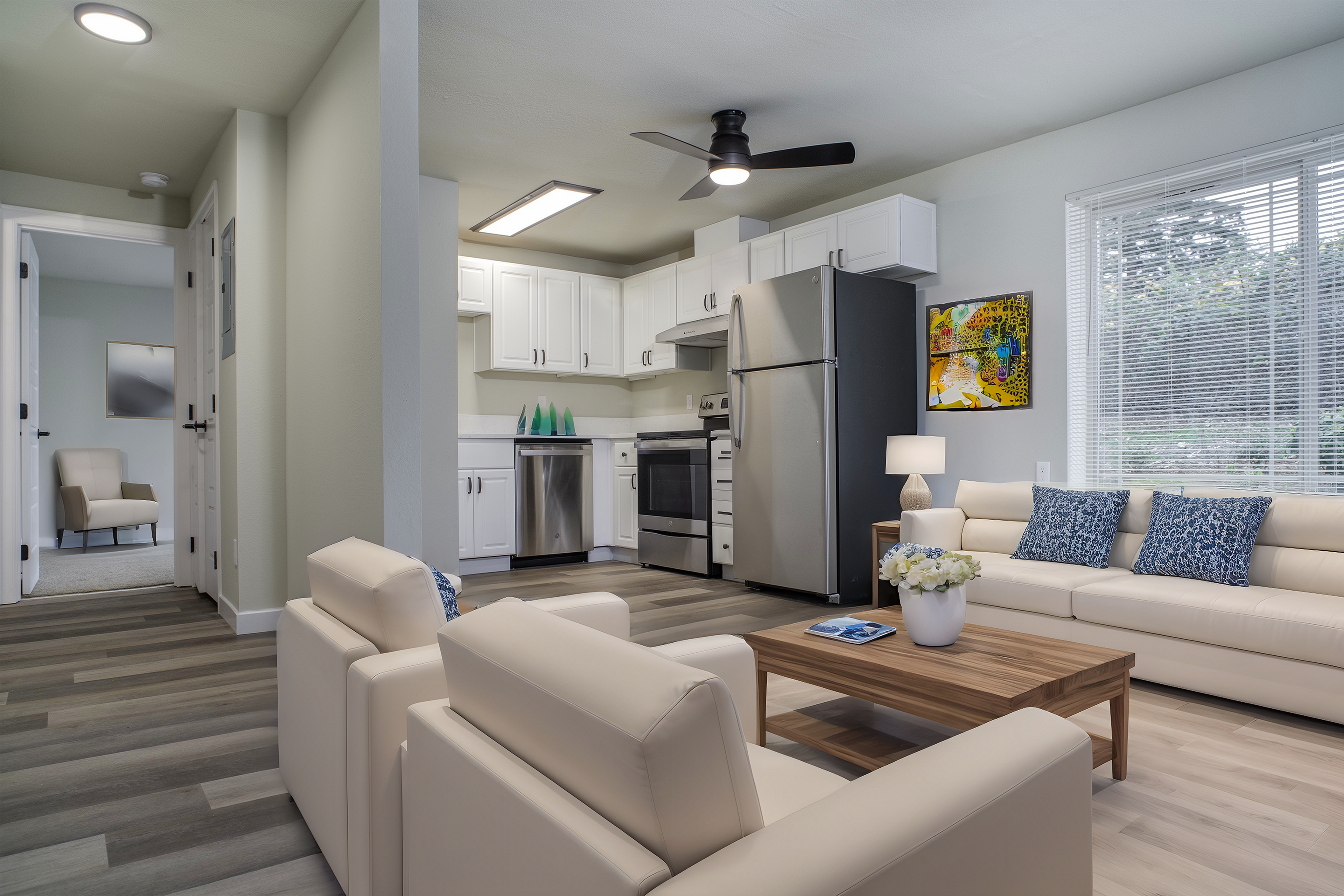 Bright and modern open-plan living area with a sleek kitchen and stylish furnishings.