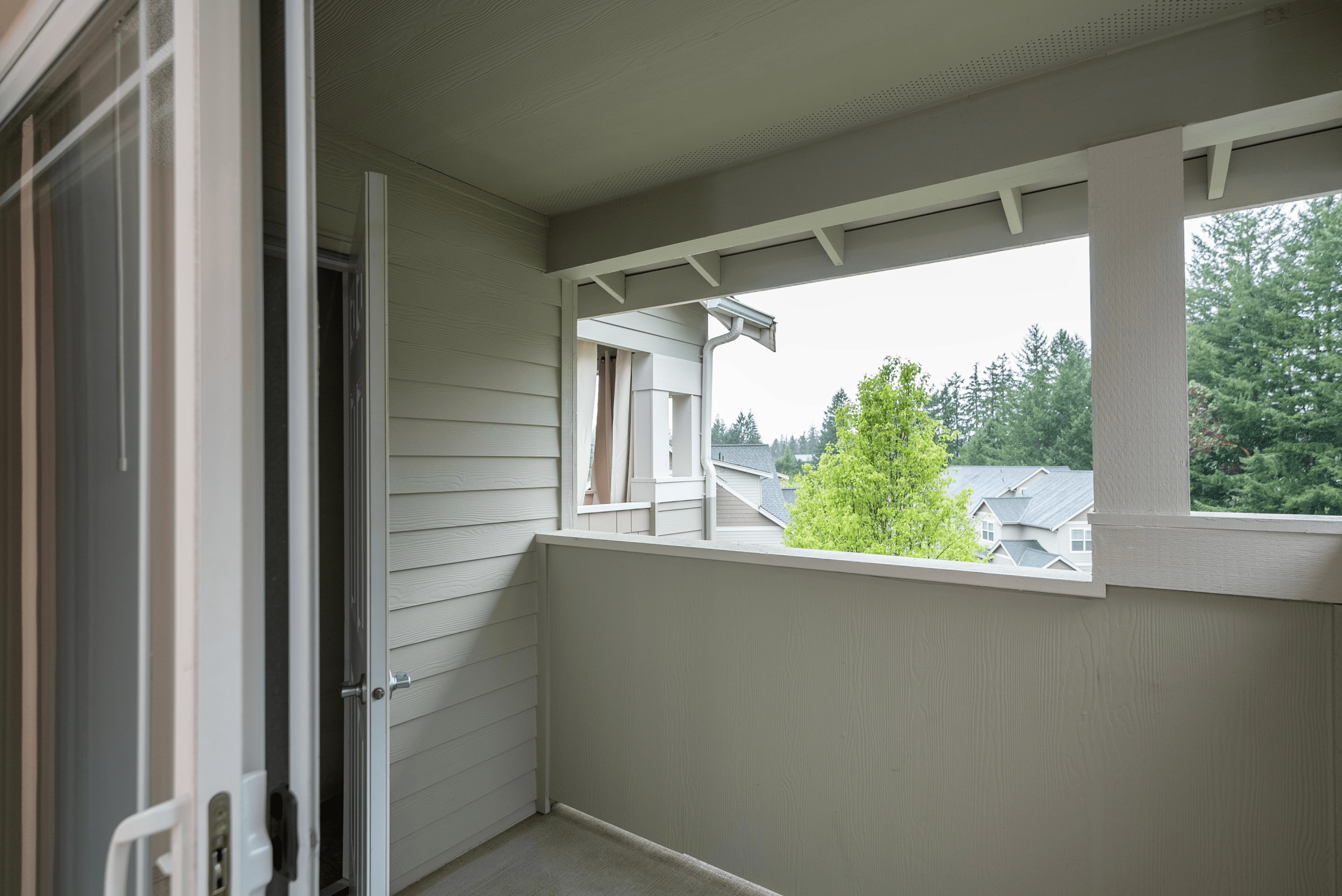 Charming apartment balcony with scenic views, perfect for relaxation and enjoying nature.