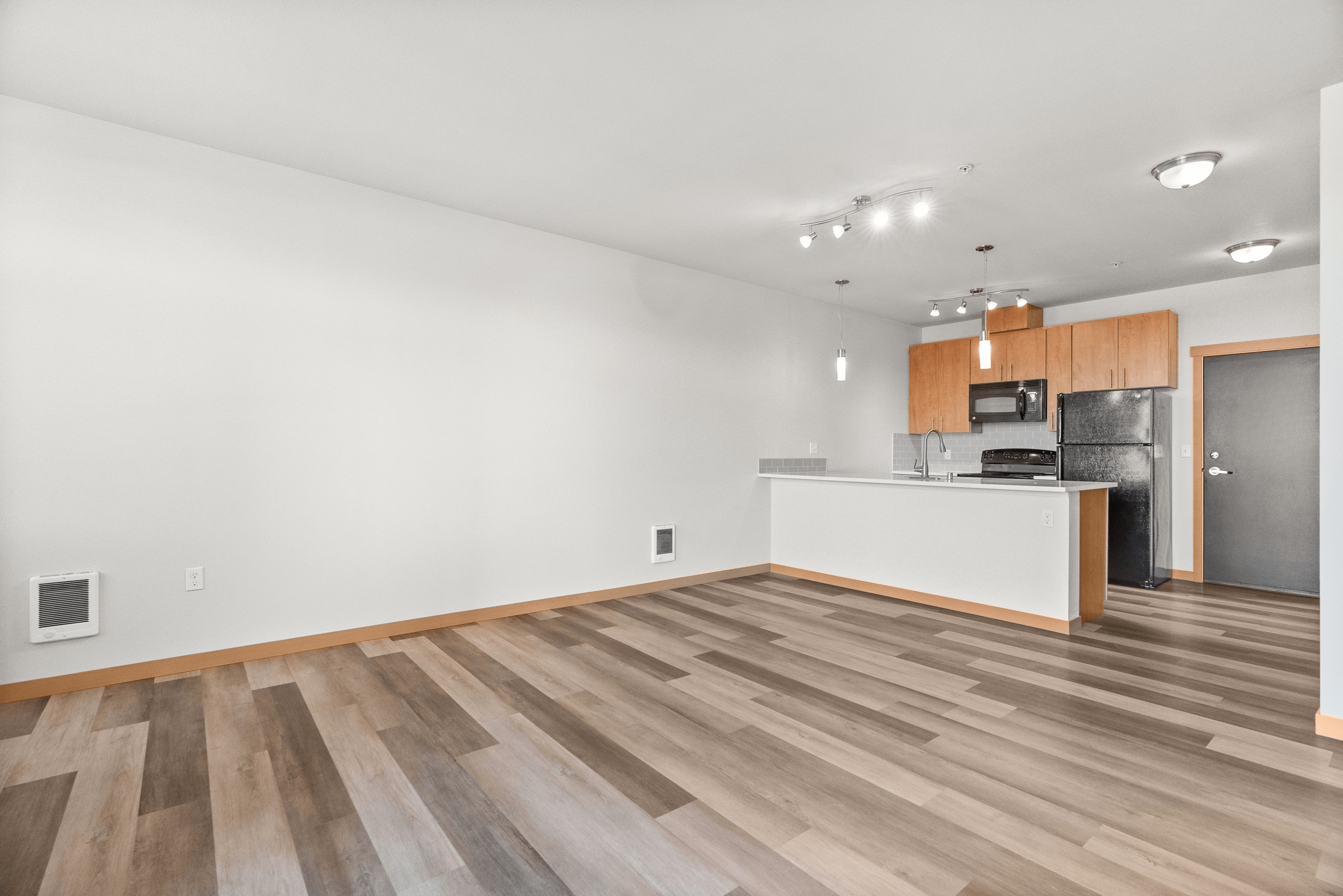 Living Room + Kitchen l Marketplace Flats Apartments l University Place, WA