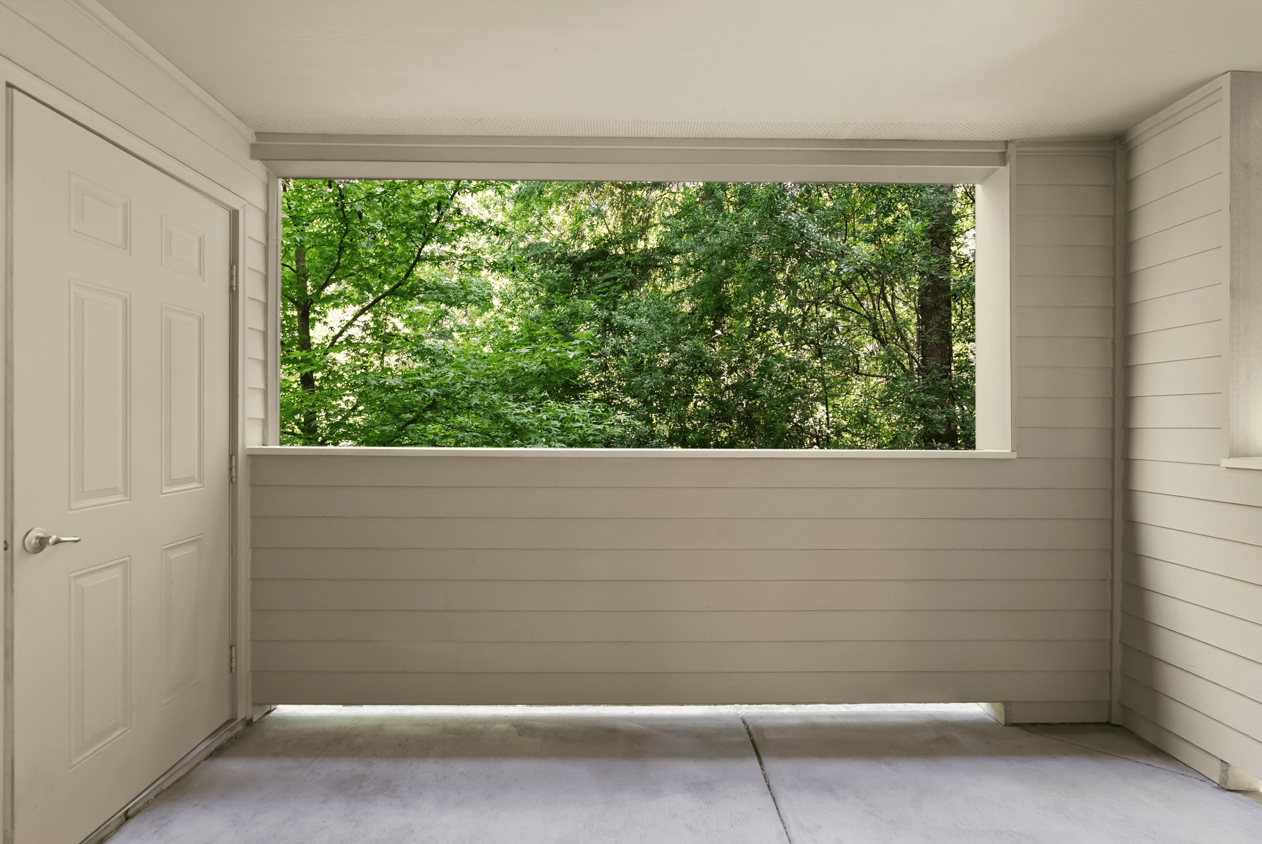 Peaceful balcony with serene forest view, perfect for relaxation and fresh air.