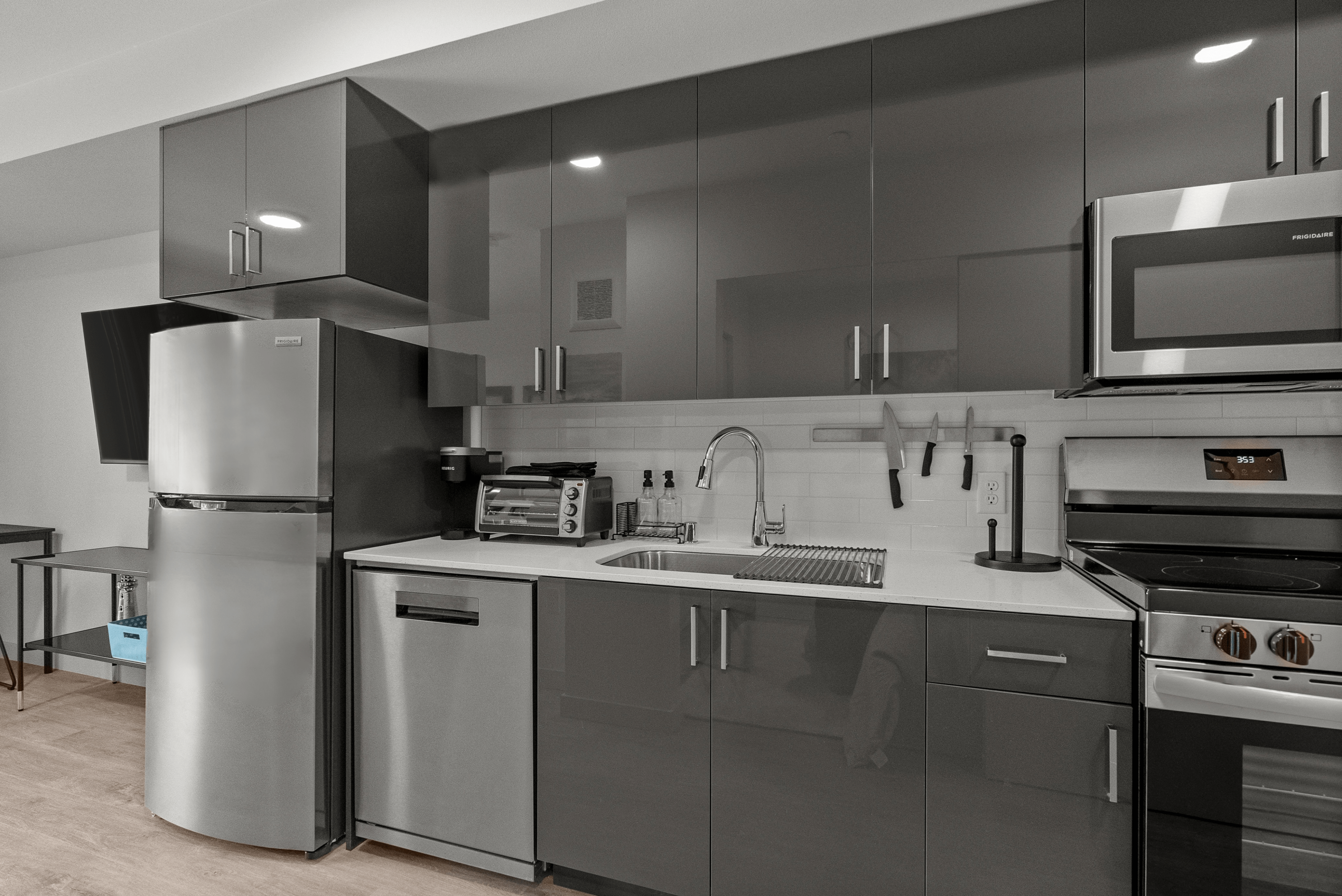 Sleek modern kitchen with glossy cabinetry, stainless steel appliances, and elegant countertops, perfect for contemporary living.
