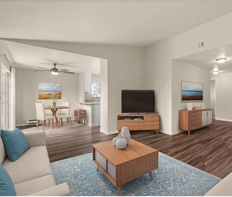 Bright open-concept living and dining area with modern furnishings and wood flooring.