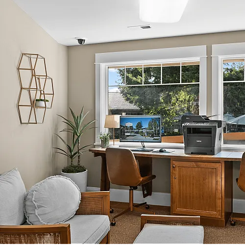 Apartment community business center with workstations, computer, and printer