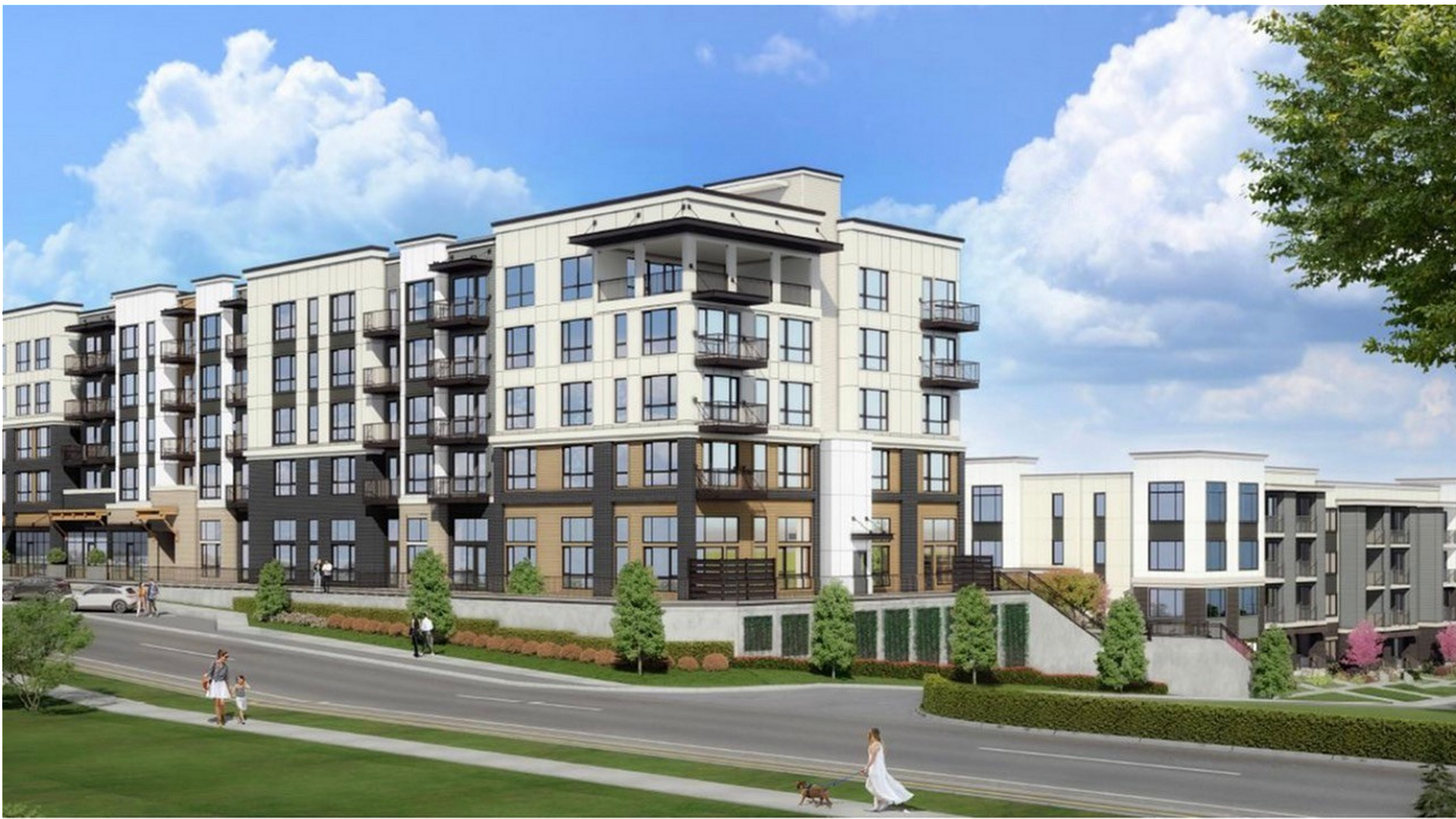 Modern apartment complex with spacious balconies, lush landscaping, and a vibrant street view.