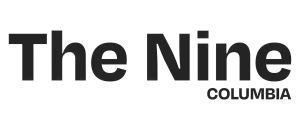 Sleek and modern logo for The Nine Columbia, showcasing elegant typography and contemporary design.