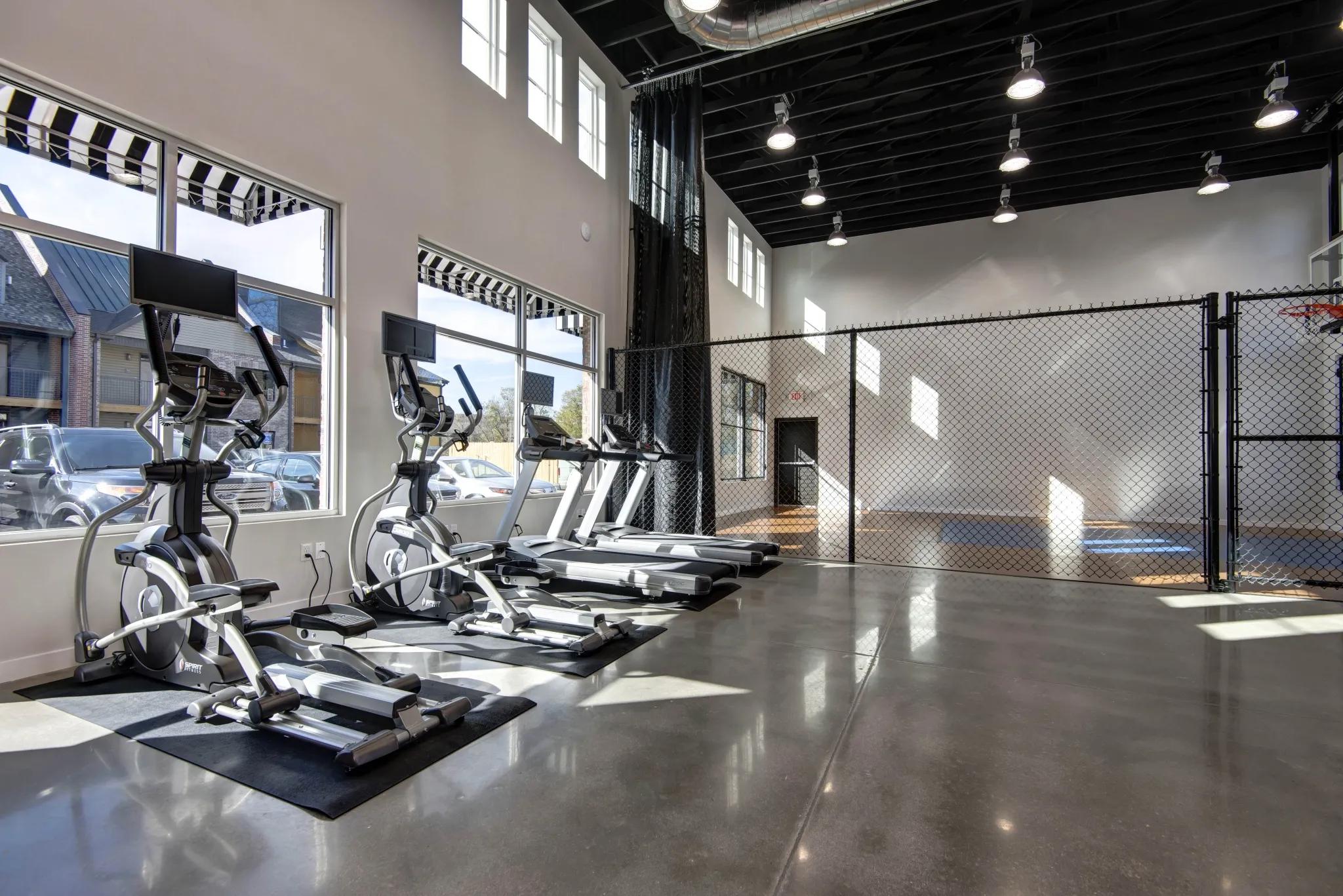 Township 28 Apartments amenity fitness center and indoor basketball court