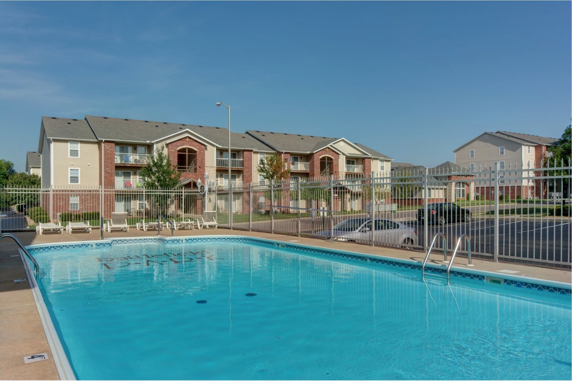 outdoor swimming pool and exterior apartment buildings at Battlefield Park