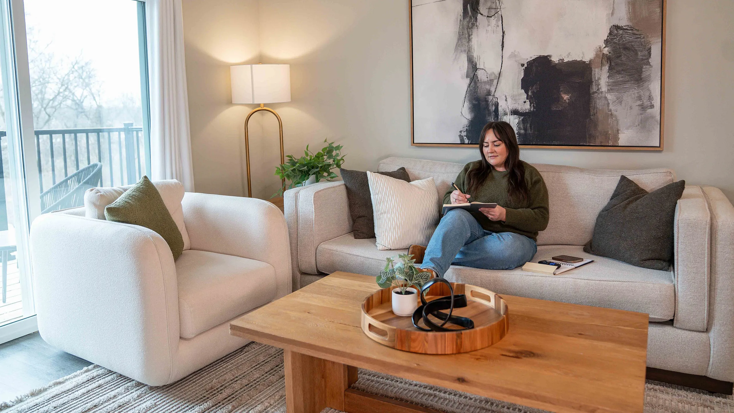 Crescent-Falls-Apartments-For-Rent-Joplin-Missouri-Journaling-On-Couch