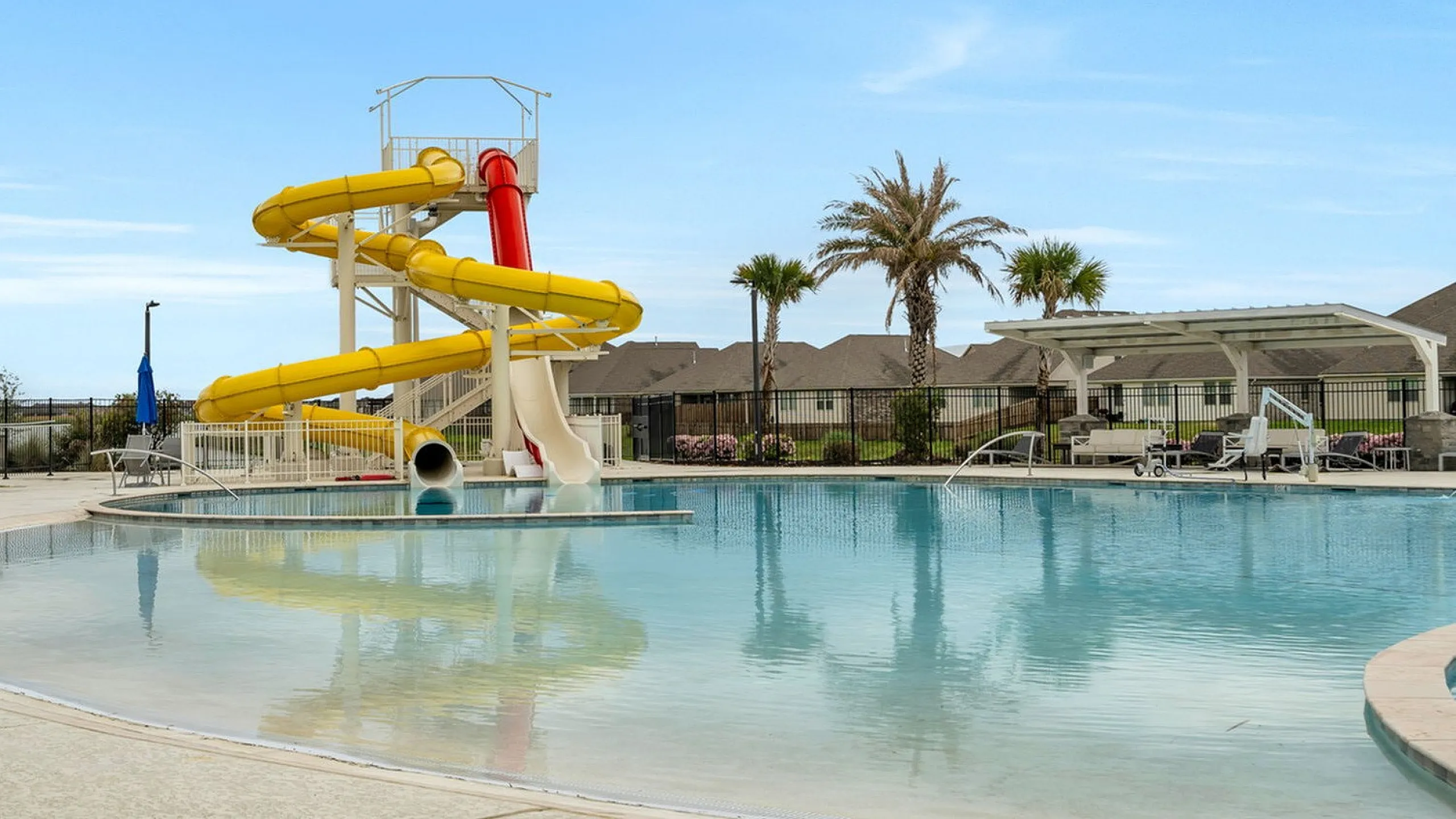 Waterslide, pool, splashpad at clubhouse. Summer fun