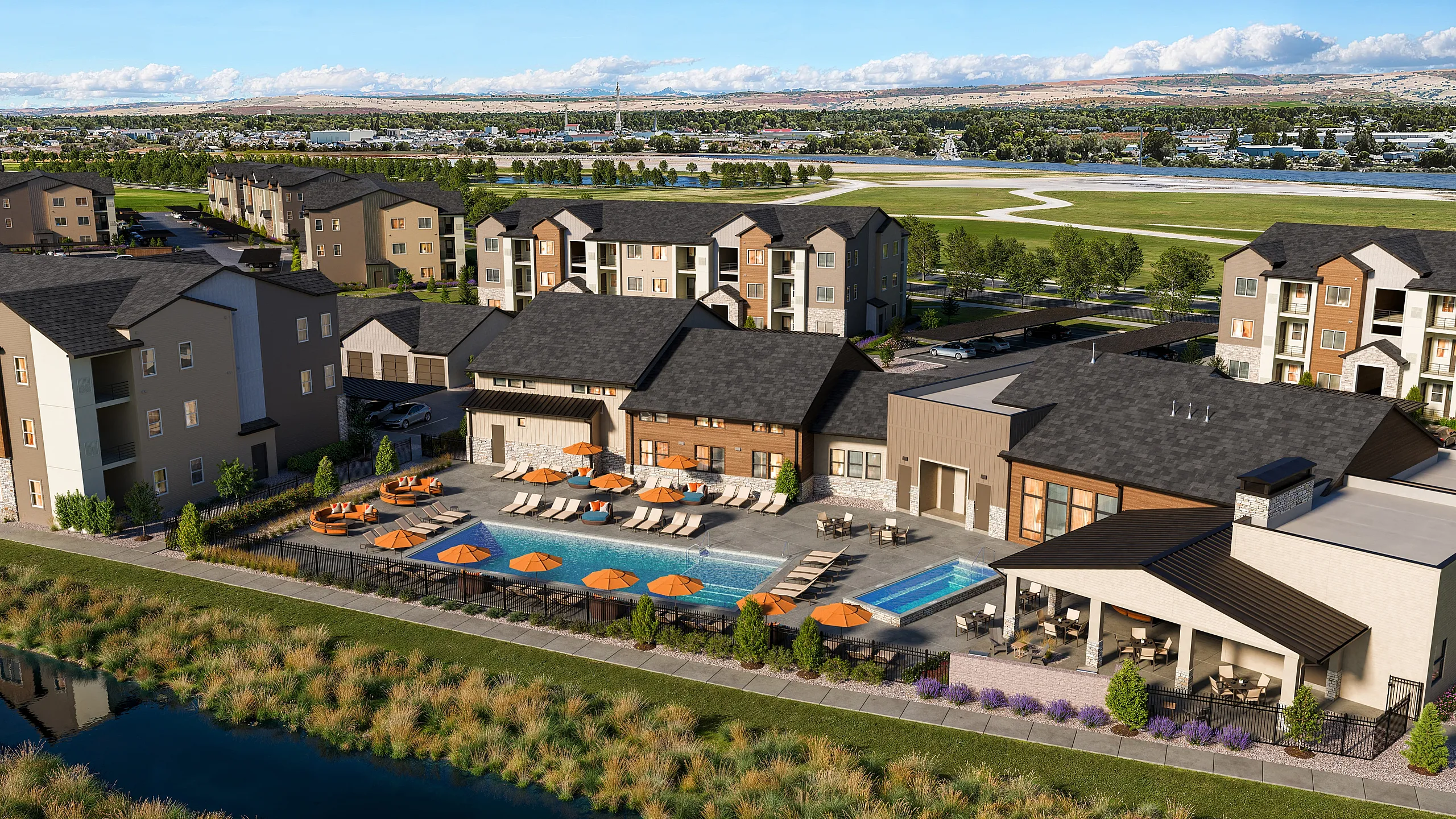Luxurious apartment complex with scenic views, featuring a stunning outdoor pool, lounge areas, and beautifully landscaped surroundings.
