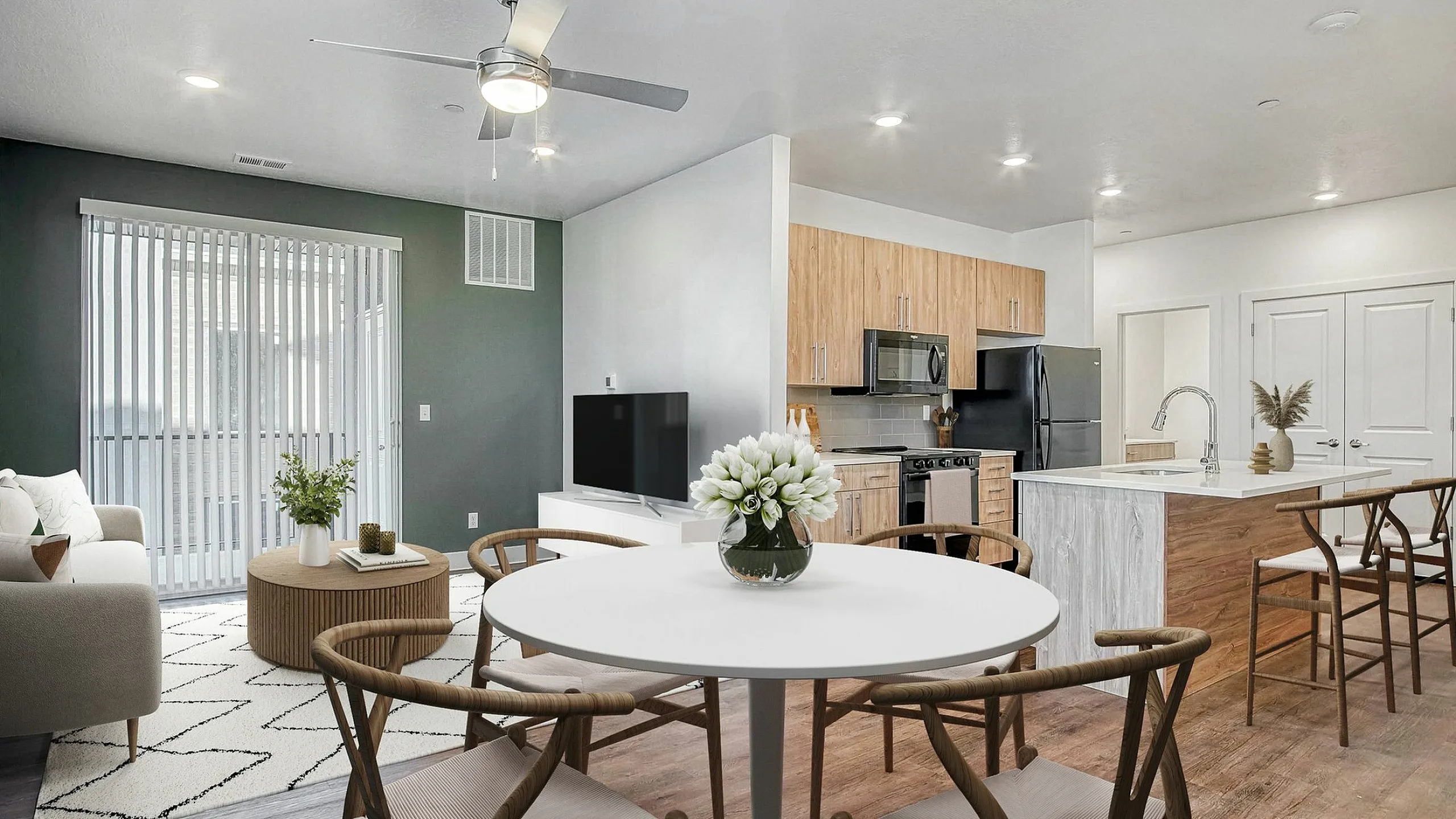 Elegant open-concept living space with modern kitchen, cozy seating area, and stylish dining set, perfect for entertaining.