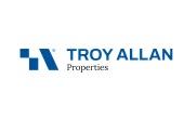 Modern Troy Allan Properties logo in bold blue and black font with geometric design.