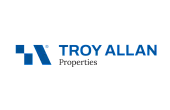 Bold and modern Troy Allan Properties logo featuring a sleek geometric design in vibrant blue.