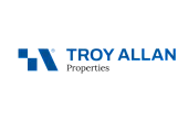 Logo of Troy Allan Properties featuring a sleek blue design element and modern typography.