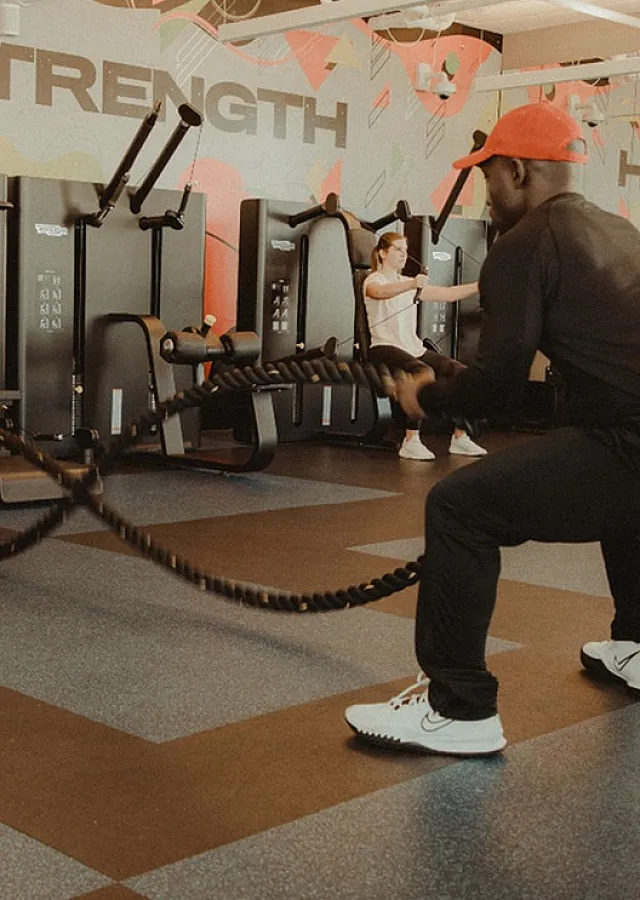 Modern fitness center featuring state-of-the-art equipment and dynamic workout space, ideal for strength training enthusiasts.