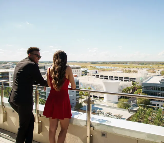 Chic apartment balcony offering stunning panoramic views, perfect for enjoying cityscapes and serene landscapes.