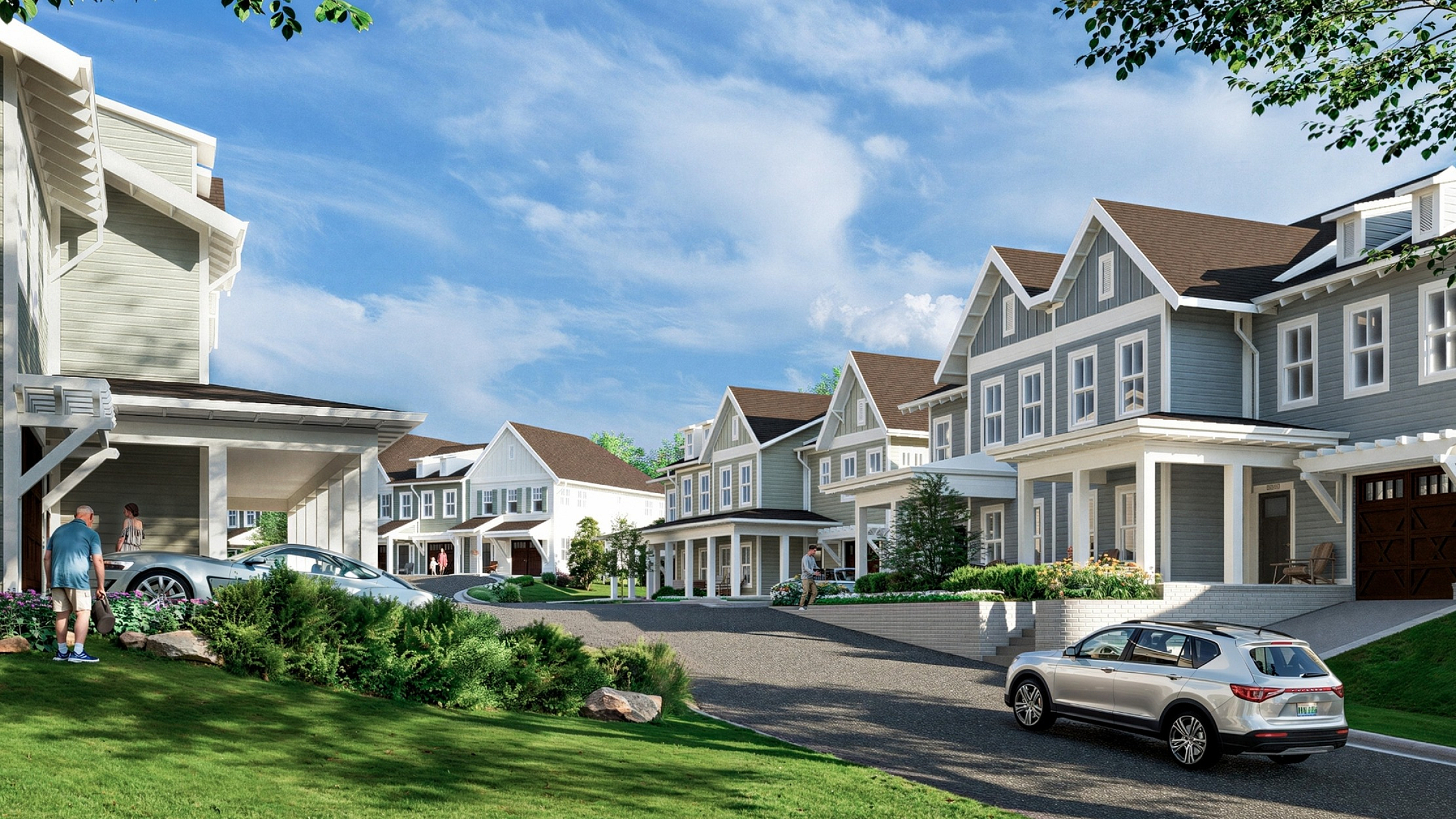 Charming suburban neighborhood with modern townhouses, lush green lawns, and a clear blue sky.