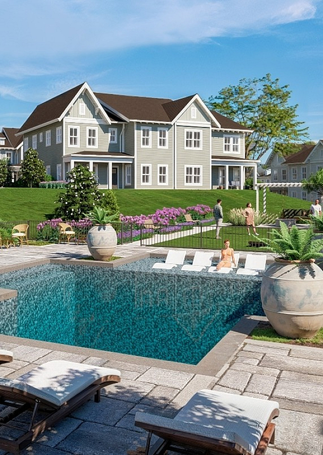 Charming community pool area surrounded by elegant homes and vibrant landscaping, perfect for relaxation and socializing.
