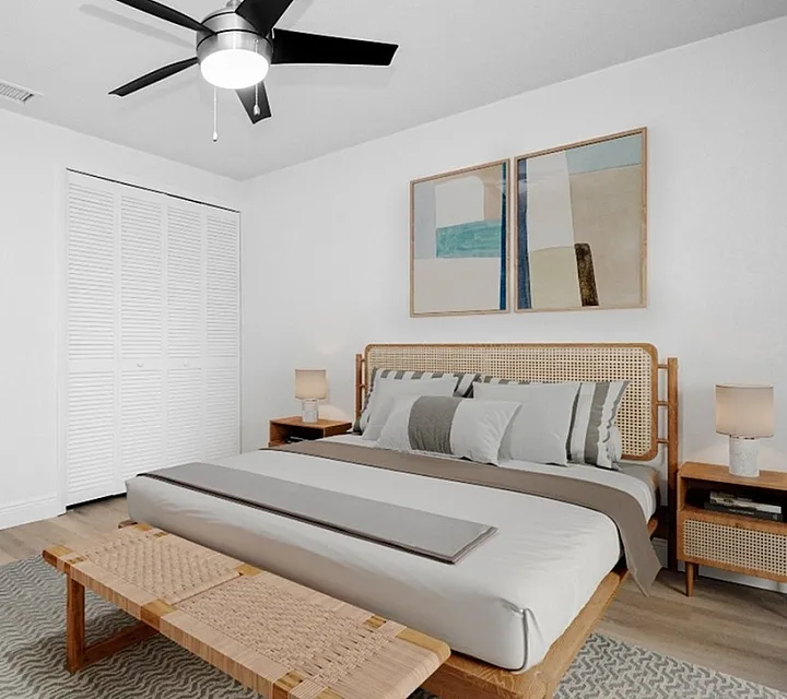 Chic bedroom with a contemporary design featuring a cozy bed, stylish ceiling fan, and modern decor with art pieces on the wall.