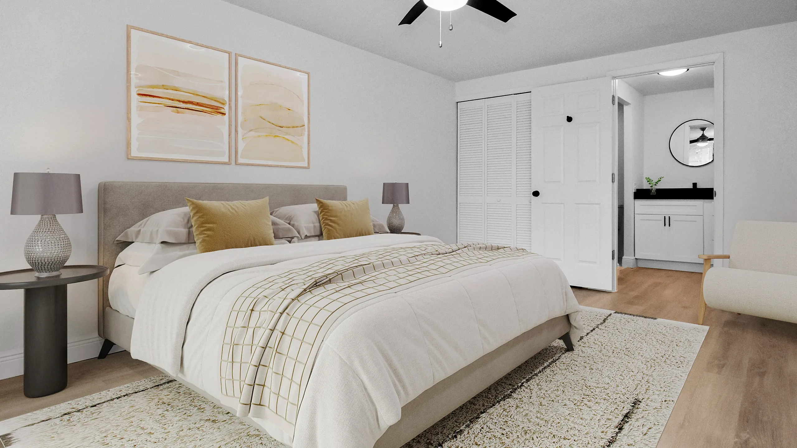 Chic bedroom showcasing a plush bed with elegant cushions, stylish ceiling fan, and contemporary artwork, leading into a modern ensuite bathroom.