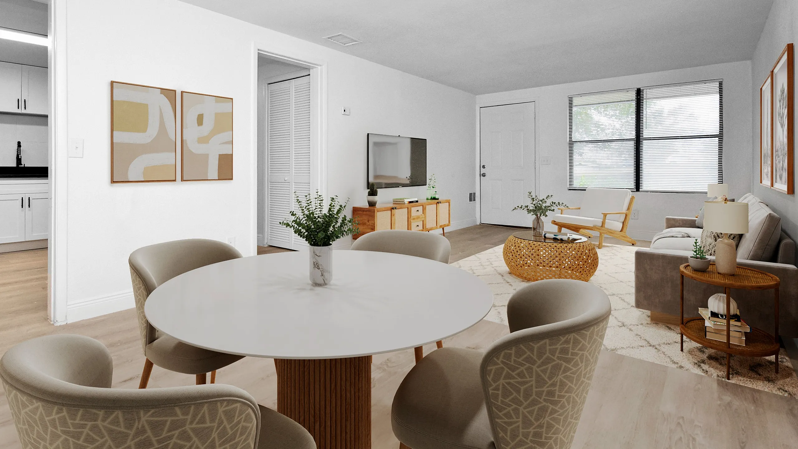 Inviting open-plan living space featuring modern dining area, cozy seating, and a stylish kitchen with chic decor.