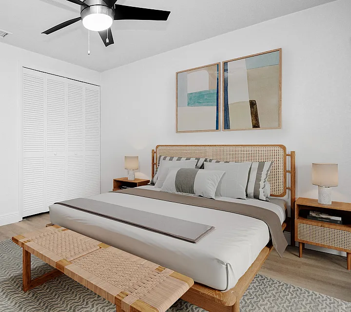 Inviting bedroom with contemporary design features a comfortable king-size bed, elegant wooden furniture, and modern ceiling fan, perfect for relaxation.