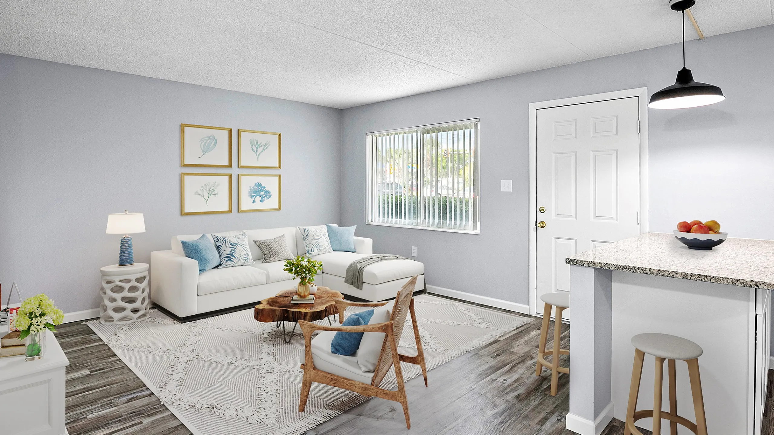 Bright and inviting living room with modern decor, cozy white sofa, stylish artwork, and a chic breakfast bar in a contemporary apartment.