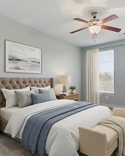 Inviting bedroom featuring a plush bed with elegant bedding, soft lighting, and large windows showcasing serene outside views.