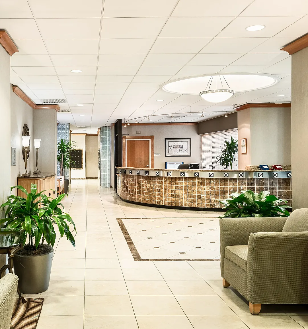 Elegant apartment lobby with modern furnishings, stylish decor, and a welcoming reception area.