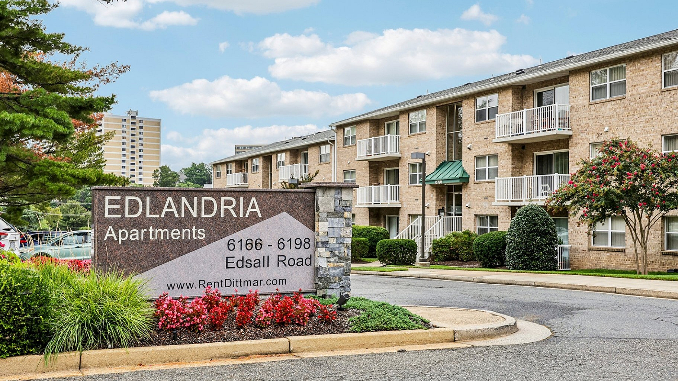 Charming Edlandria Apartments with lush landscaping and spacious balconies on Edsall Road.