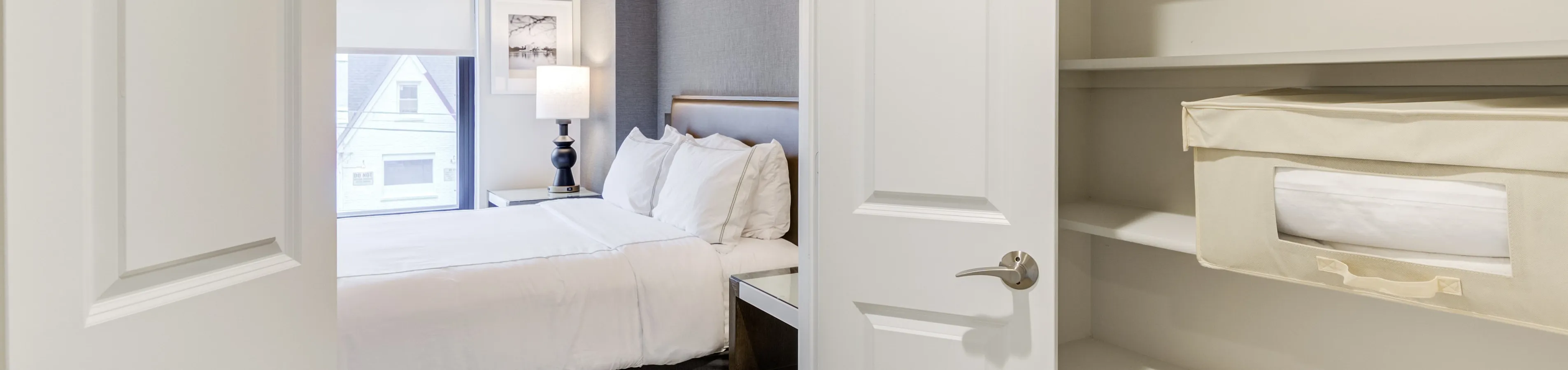 Inviting bedroom with plush bedding and stylish decor, adjacent to a spacious and organized closet.
