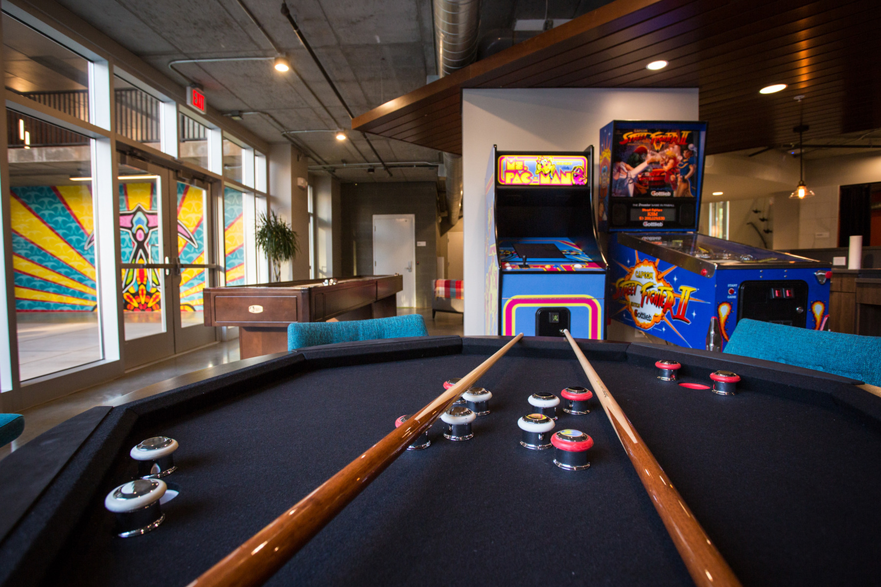 Image of Entertainment Bar with Shuffle Board Fooz Ball and Vintage Arcade Games for LIFT