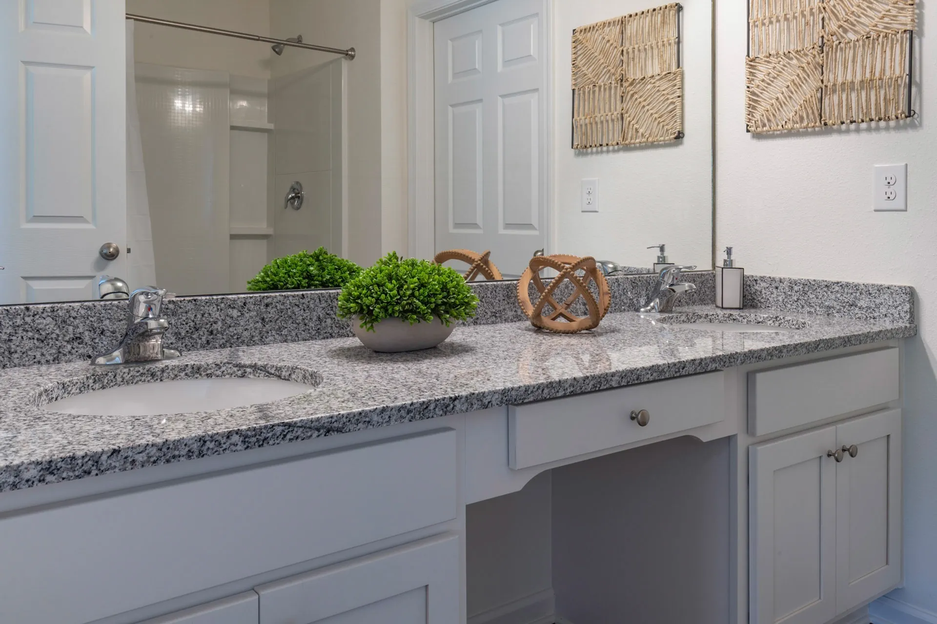 Bathroom with two sinks and large mirror