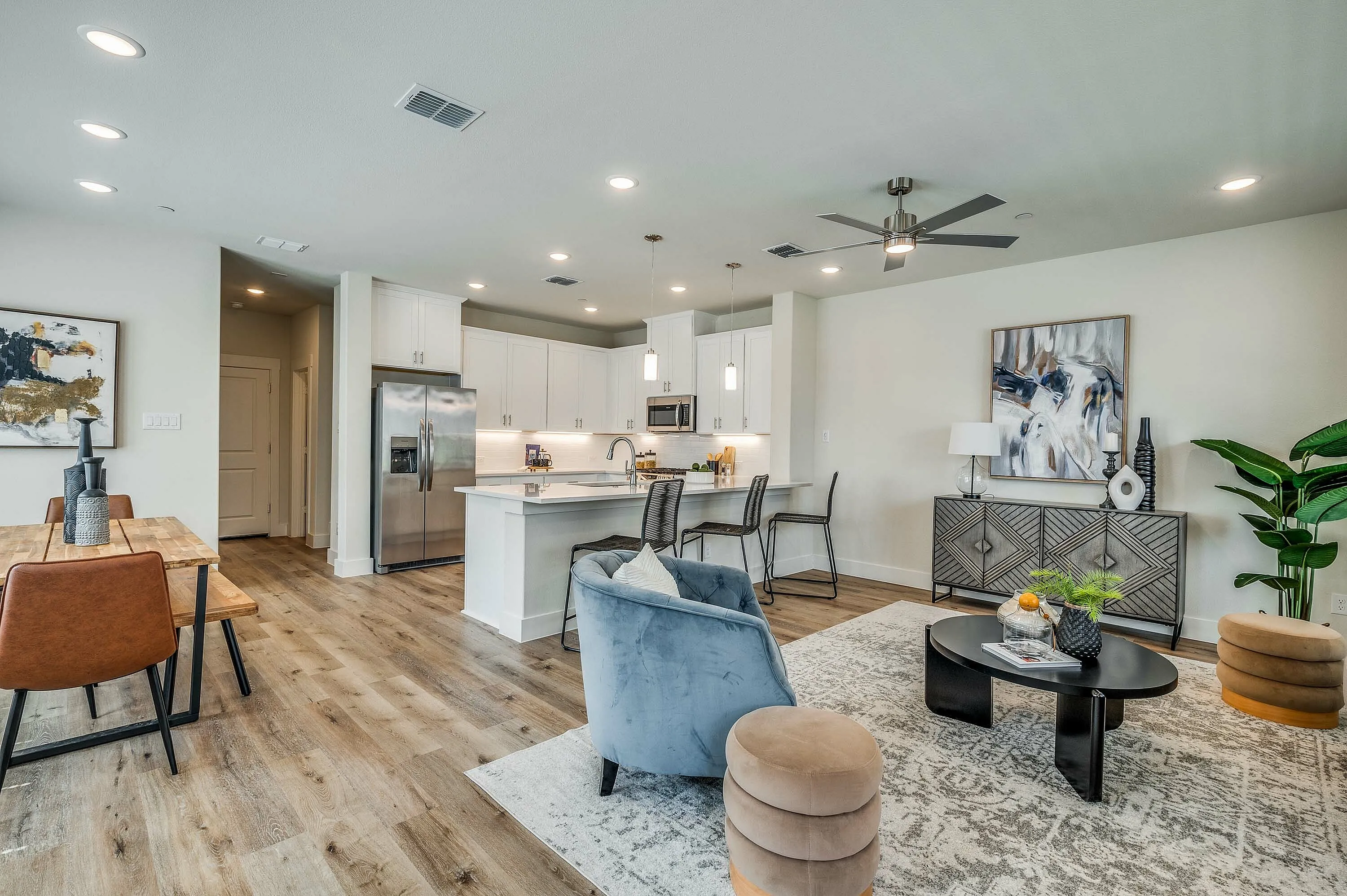 Furnished living room, dining room and kitchen