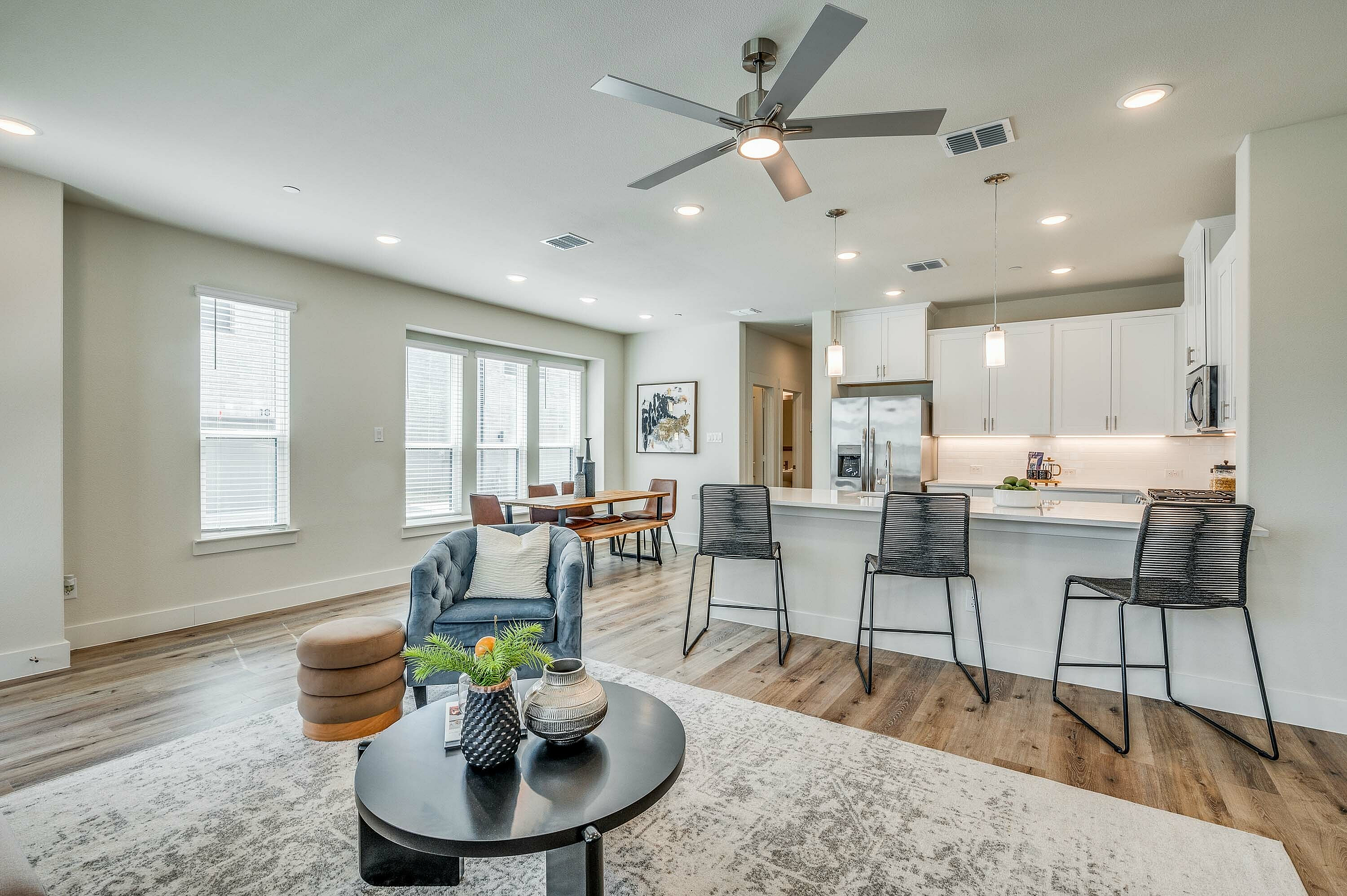 Furnished kitchen with barstools