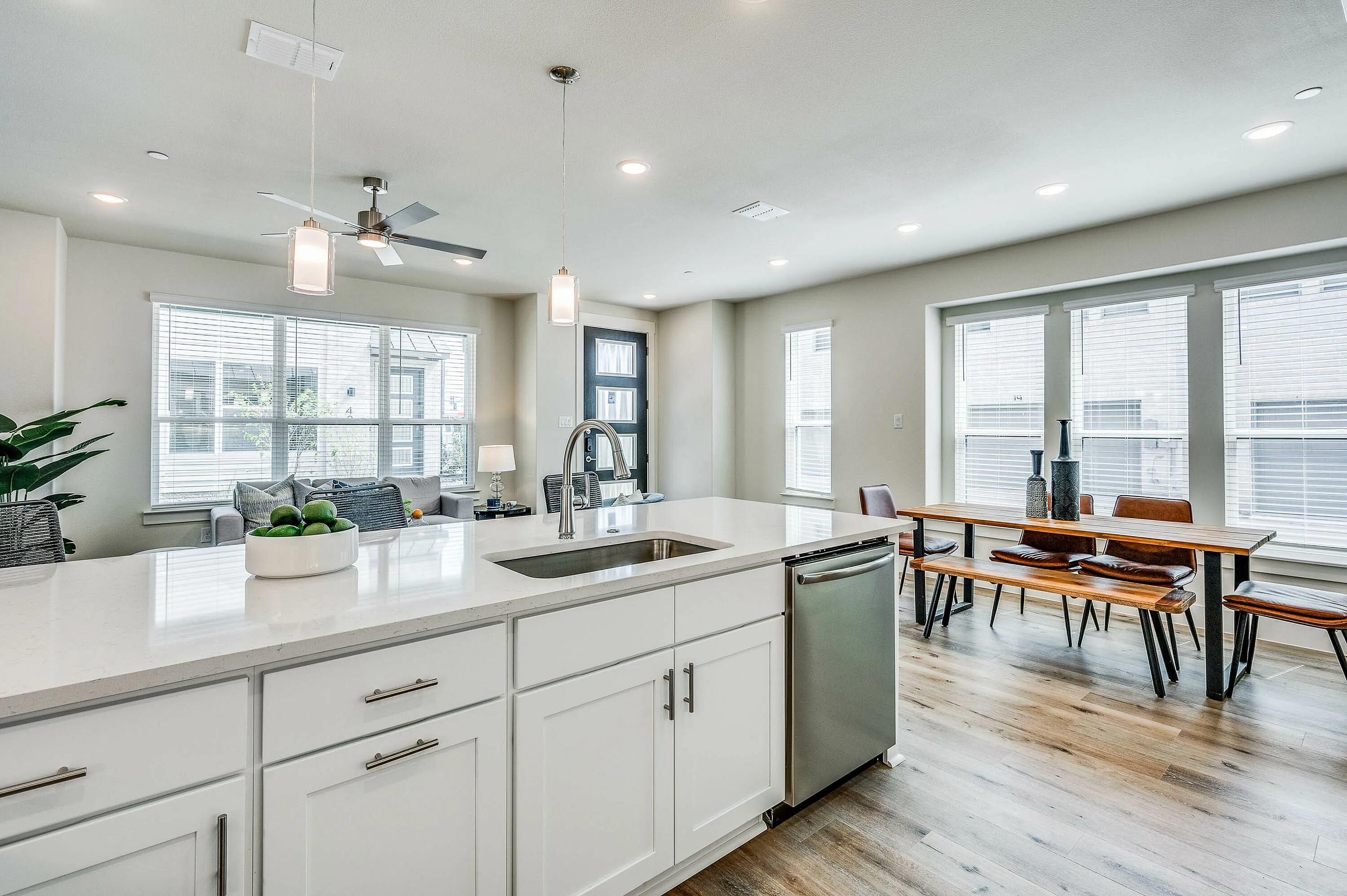 Kitchen with stainless steel dishwasher and furnished dining room