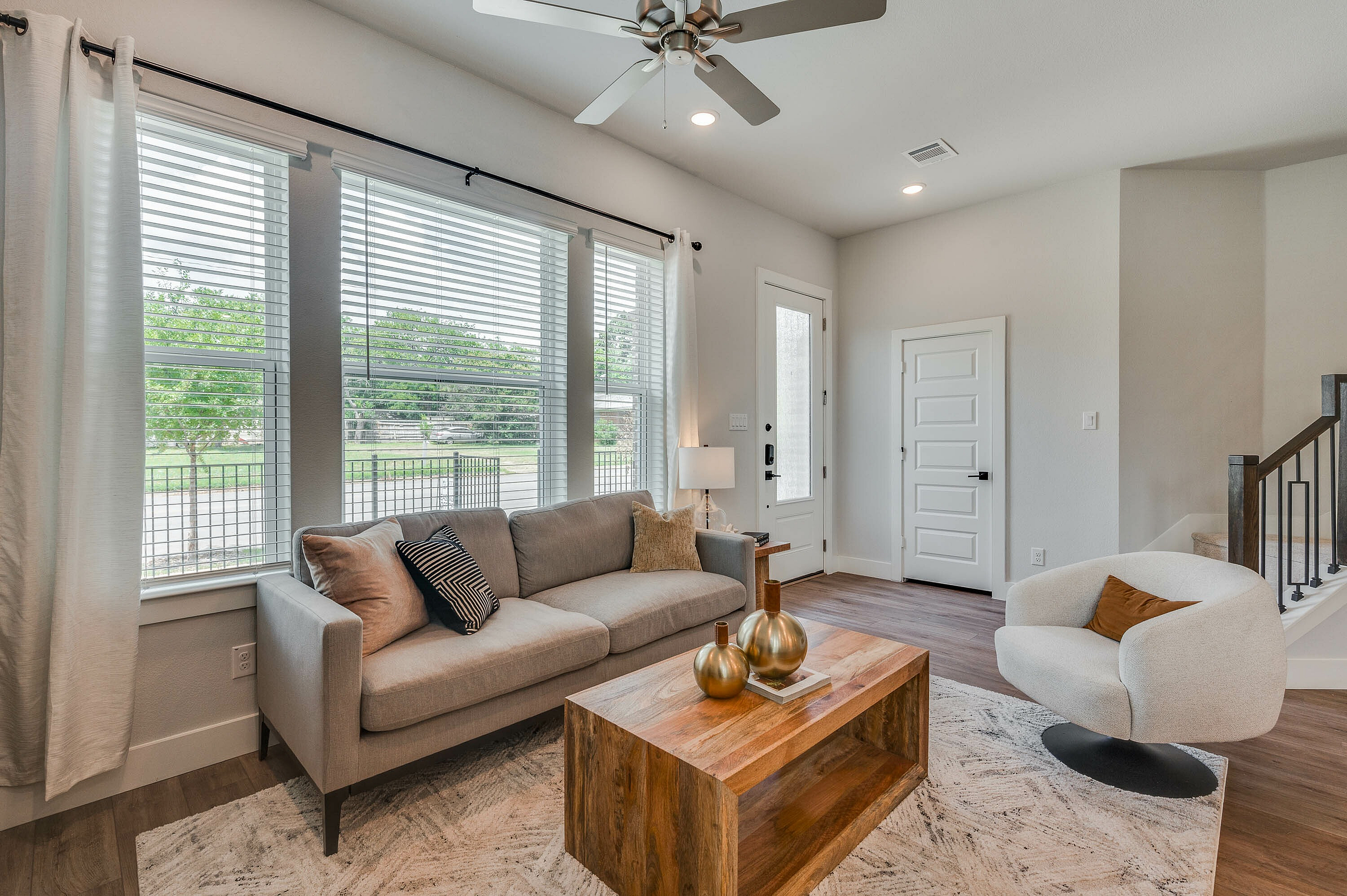 furnished and decorated living room and kitchen with wood style flooring